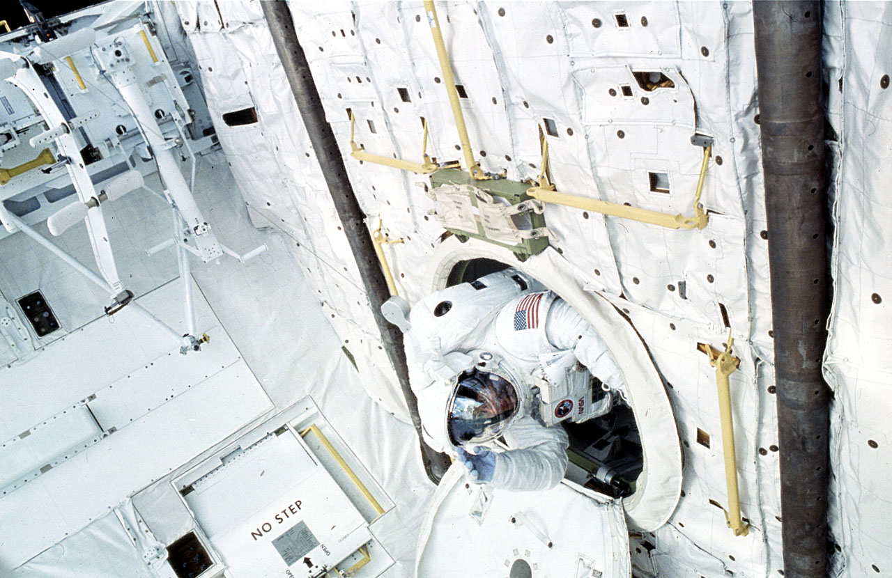 Jay Apt exiting Atlantis' airlock, one of the images Jay Apt can show as an astronaut speaker.