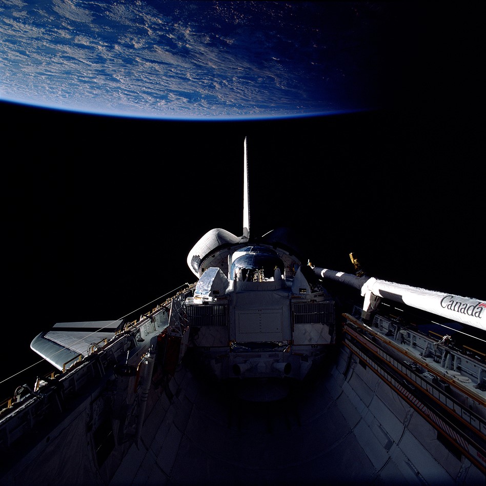 STS-37 payload bay with Earth, one of the images Jay Apt can show as an astronaut speaker.