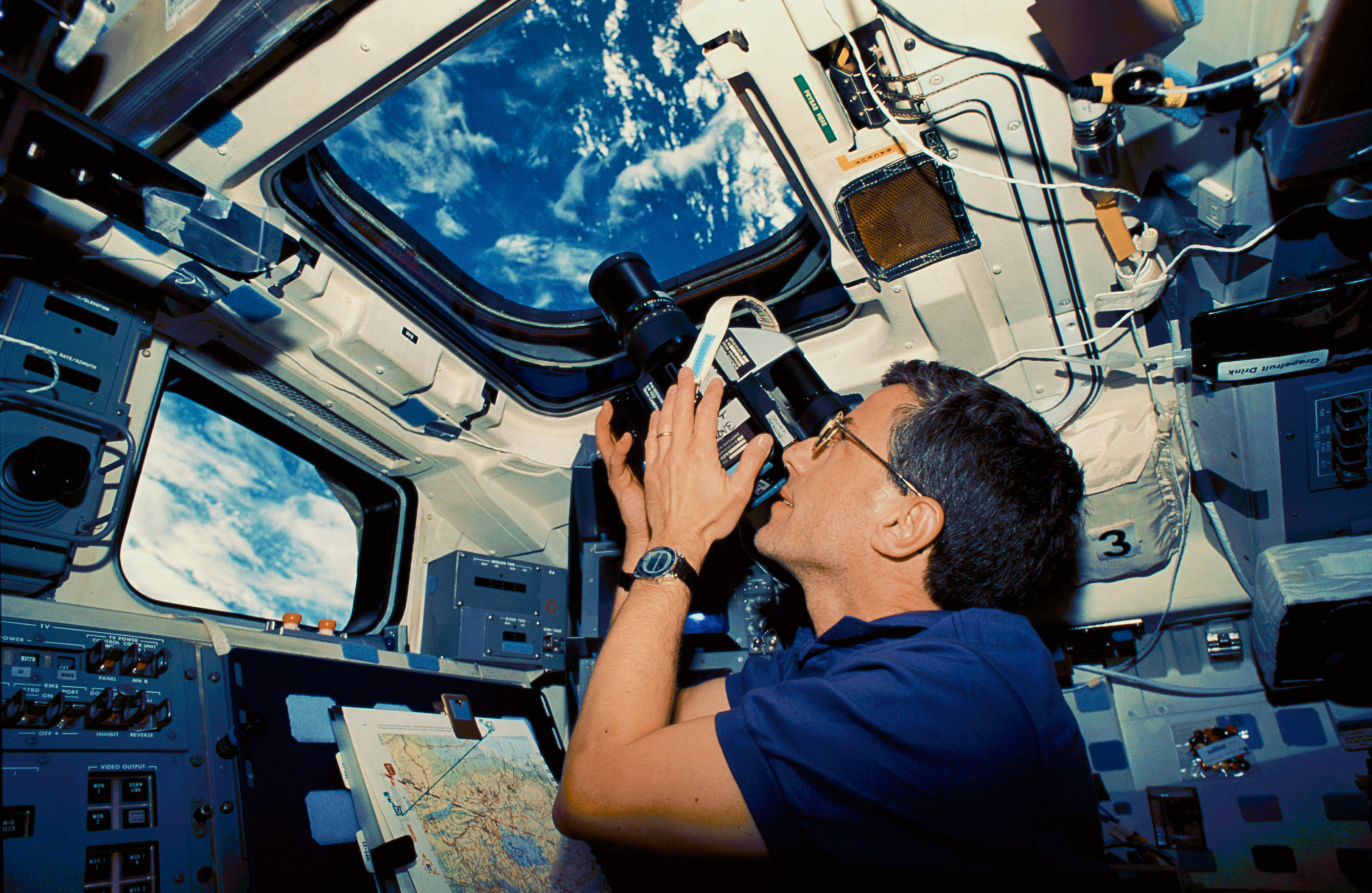 Jay with Hasselblad camera on STS-59, one of the images Jay Apt can show as an astronaut speaker.